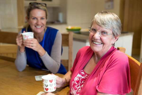 patient and nurse smiling at each other